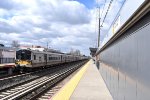 Inbound LIRR train of M7 cars at New Hyde Park station 